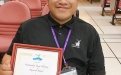 Mr. Omongos shows off his certification of Outstanding Young Chemistry Research Award